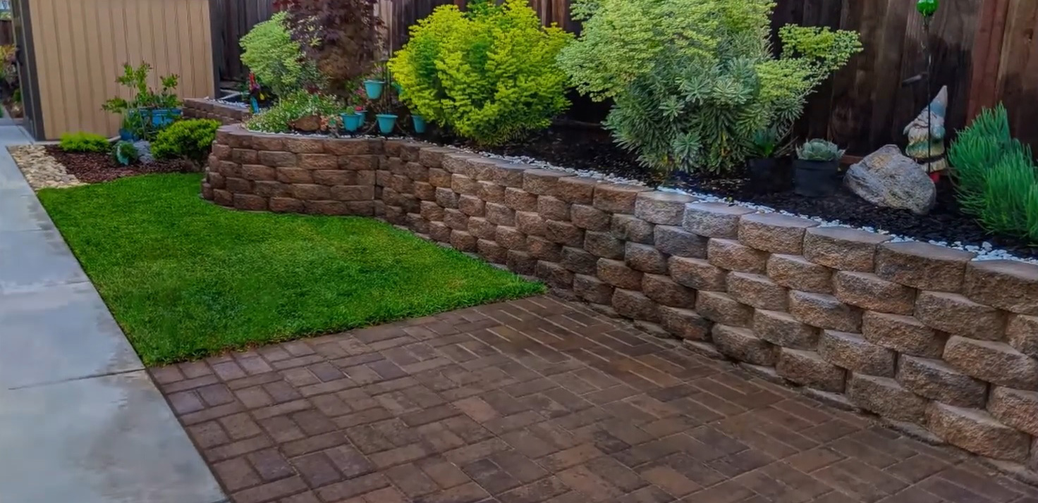 Different types of retaining wall blocks with trees and bushes above